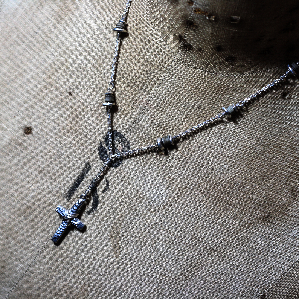 Hand made bespoke necklace, incorporating saint cuthbert beads & sterling silver cuttlefish cast cross. Handmade Jewellery uk